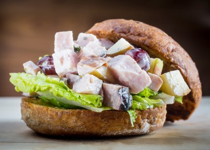Sir Waldorf -- Chunks of house-roasted turkey, Fuji apples, purple grapes, tossed in a walnut aioli, served on Bennison's Bakery Multi-Grain bun.